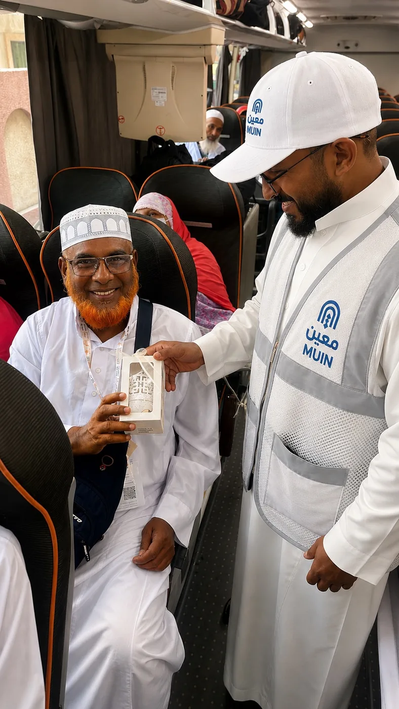 A Moeen service team member caring for a pilgrim during transport